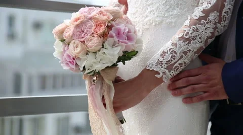 The groom embraces the bride's waist Stock Footage 54455752