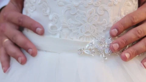The groom is embracing the bride Stock Footage 72679125
