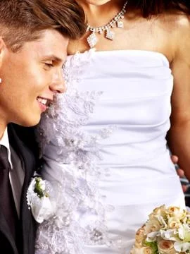 Groom embracing bride . Stock-Fotos