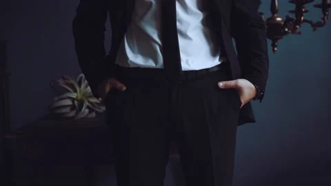 The groom fastens a button on his jacket Stock Footage 168583427