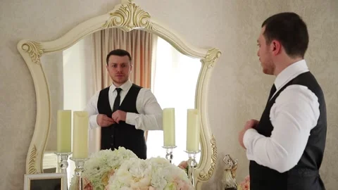 The groom fastens his jacket. Stock Footage 130180513