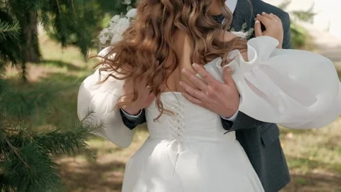  The groom gently strokes the bride on the back. Stock Footage 263722517