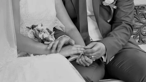 The Groom Gently Stroking the Right Hand of the Bride Stock Footage 61507018