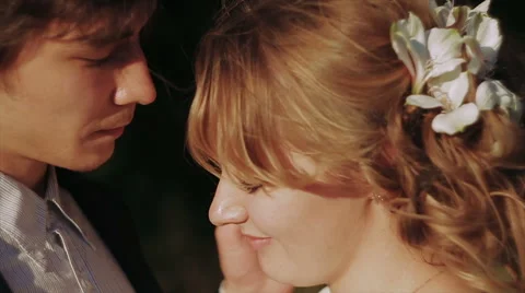 Groom Gently Touched to Bride Face at Sunset Stock Footage 62353549