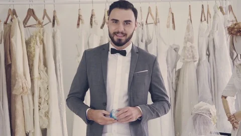 Groom giving the wedding diamond ring towards camera. Stockbeeldmateriaal 119895979