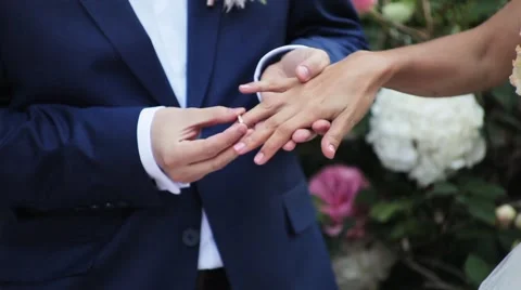 The groom hardly wears the ring on the bride finger Stock Footage 57482295