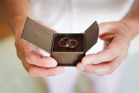 Groom holding beautiful box with wedding rings groom holding a beautiful b... Stock Photos