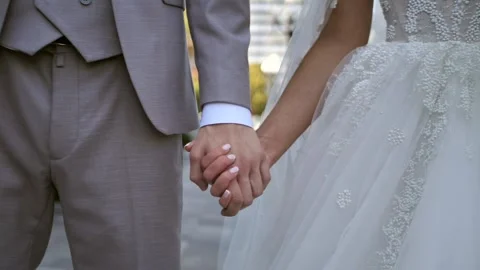The groom holds the bride's hand. Hands close up Stock Footage 291538286