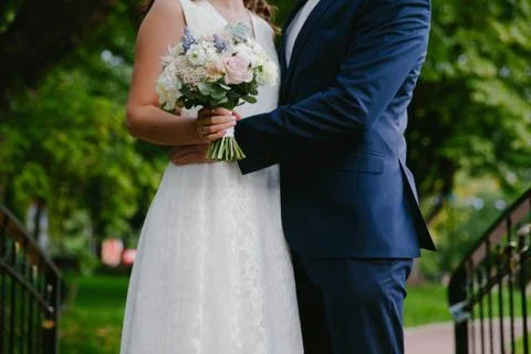 Groom hugging bride Stock Photos