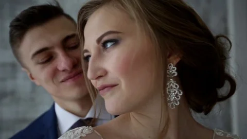 Groom hugs bride in a loft interior Stock Footage 69828014