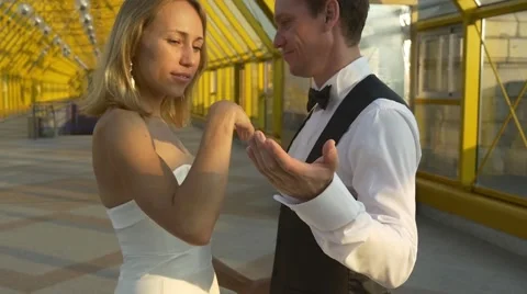 Groom invites bride for a dance Stock Footage 67618408