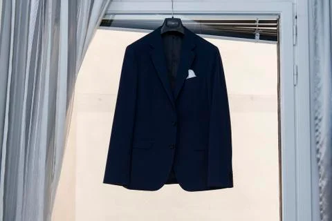 The groom jacket hangs on the ceiling Foto stock