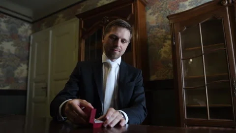 The groom opens a box with wedding rings Stock Footage 278406513