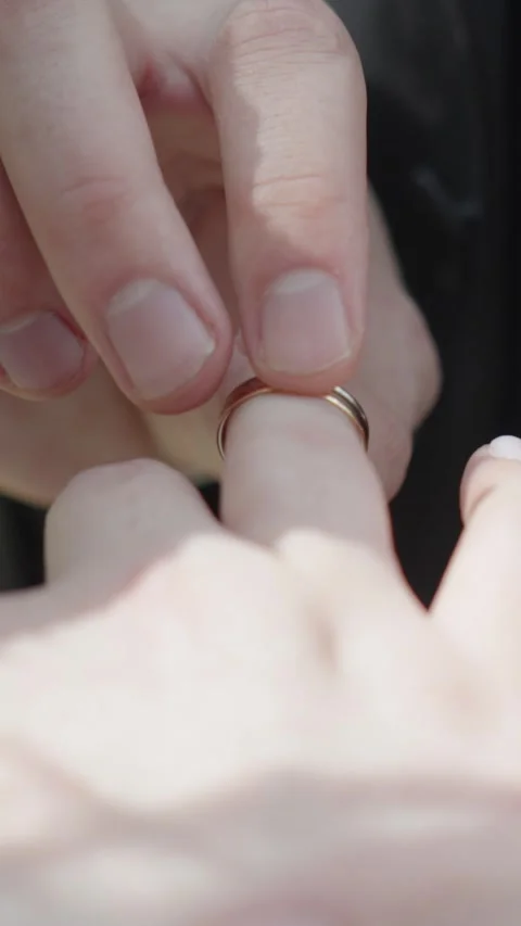 Groom Putting Gold Ring on Bride Finger Close Up Stock Footage 340234199