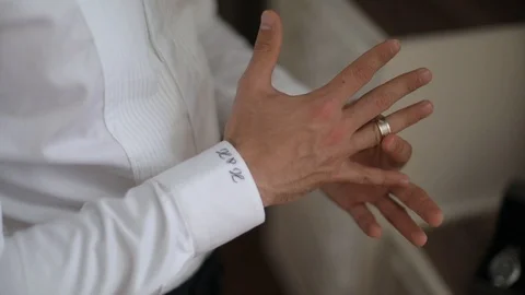 Groom is  putting the ring on the finger Stock Footage 98587277