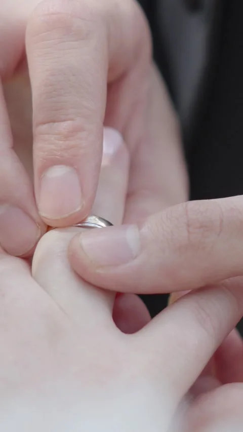 Groom Putting Wedding Ring on Bride Finger Extreme Close Up Stock Footage 342030712