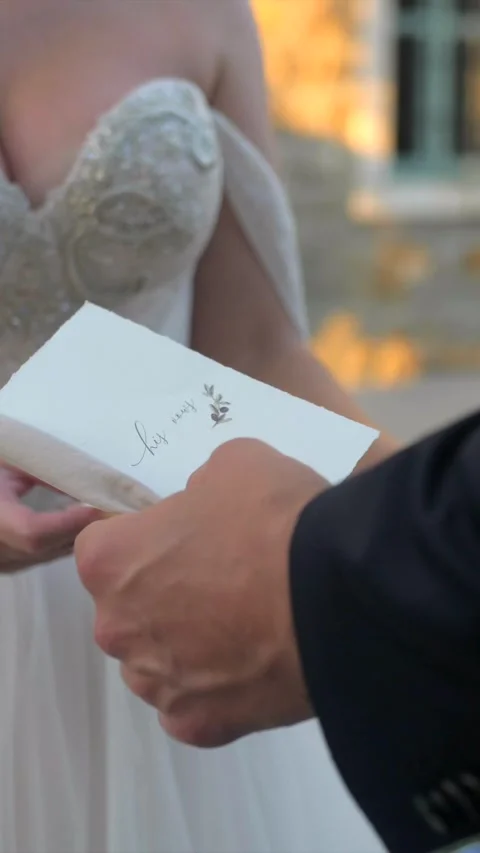 Groom reading vows to bride, closeup slow motion, elegant wedding dress classy Stock Footage 333052307