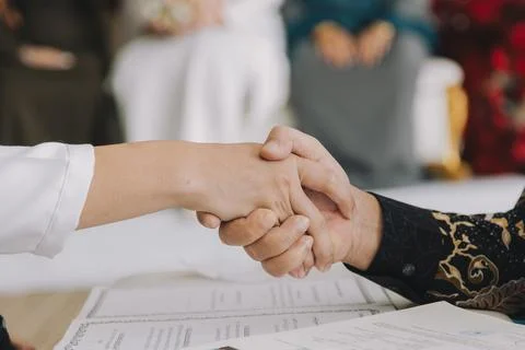 Groom Shaking Hands During Nikah Ceremony. Stock Photos