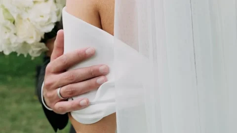 Groom stroking bride's hand close-up Stock Footage 238373674