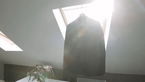 Groom suit on window background. Sun rays Stock Footage 128859418