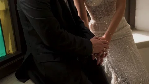 The groom tenderly embraces the bride with his arms on their wedding day Video stock 329249341