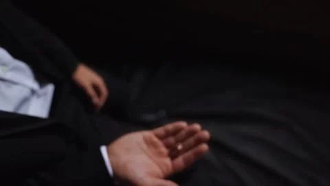 Groom throws up and holding wedding rings close up several times. Slow motion Stock Footage 242428921