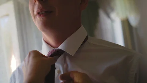 To the groom tie a tie Stock Footage 93842823