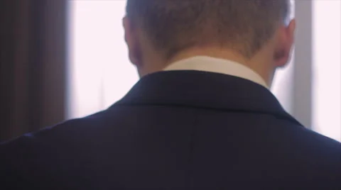 Groom Wearing a Jacket Over His Shoulder Stock Footage 62772007