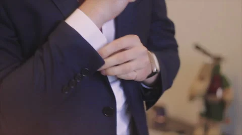 Groom Wearing a Jacket Over His Shoulder Video stock 62772489
