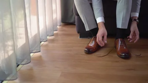 Groom  wearing shoes  Stock Footage 155774530