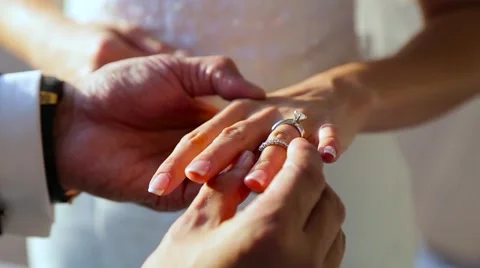 Groom wears a bride a wedding ring Stock Footage 61926072