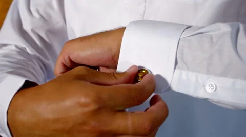 The groom wears cufflinks Stock Footage 58054050