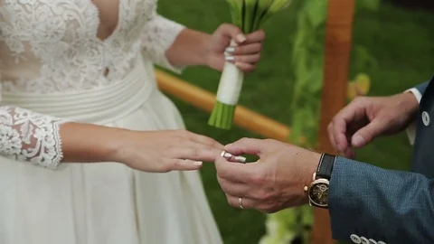 The groom wears the ring bride Stock Footage 85365439