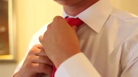 The groom wears a tie Stock Footage 45833333