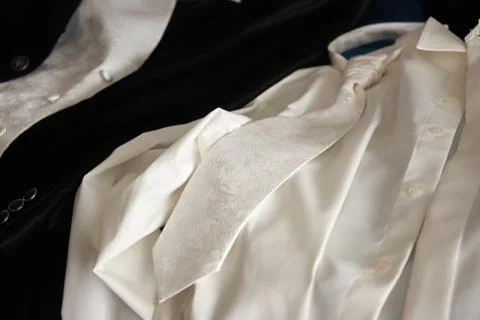 Groom wedding suit on bed Stock Photos