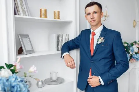 The groom in a wedding suit, posing in the Studio Stock Photos