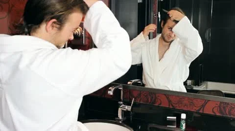 Grooming in front of mirror V6 - HD Stock Footage 12234600