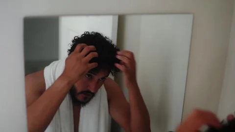 Grooming man applying cream and styling hair Stock Footage 336974950