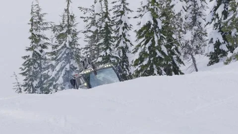 Grooming the snow on a ski slope Stock Footage 285396757