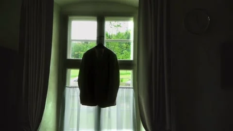 The groom's suit is hanging on the window. preparing for the wedding. Stock Footage 279879826
