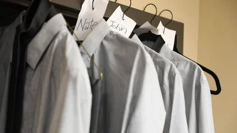 Groomsman Hangs Up Clothes Stock Footage 116442936