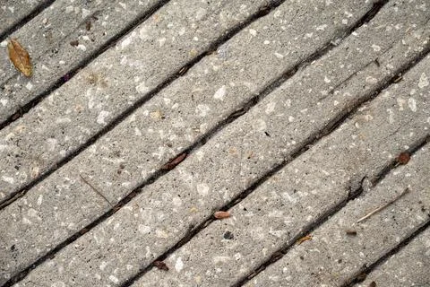 Grooved concrete surface with diagonal textured pattern Stock Photos