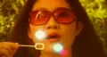 Groovy girl blows rainbow bubbles. HD Footage