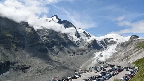 Grossglockner glacier parking and clouds in the peaks in Alps mountain Stock Footage 111942942