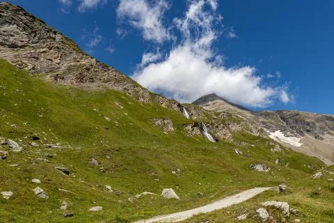 The Grossglockner mountain range in Austria with a winding road Stock Photos
