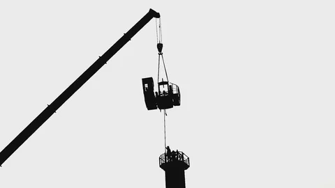 Grotesque retro like working laborers building the crane, accerelated video Stock Footage 82491362