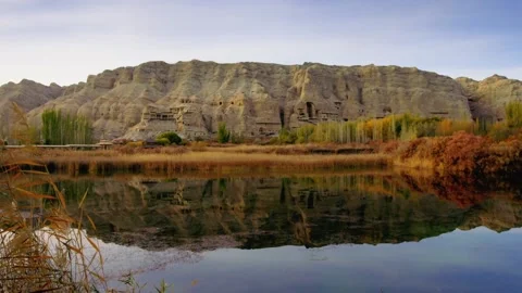 Grotto by the water in Xinjiang Stock Footage 235106912