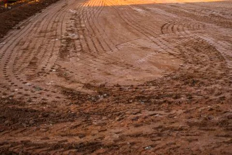 Ground after soil compactor. Paving. Compaction of the road. Stock Photos