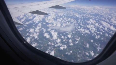 Ground and clouds from airplane window near Paris Stock Footage 275558654