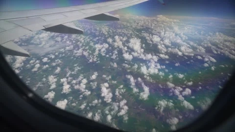 Ground and clouds from airplane window near Paris Stock Footage 275558684